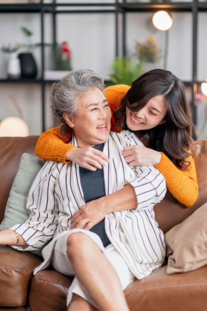Mother and daughter hugging