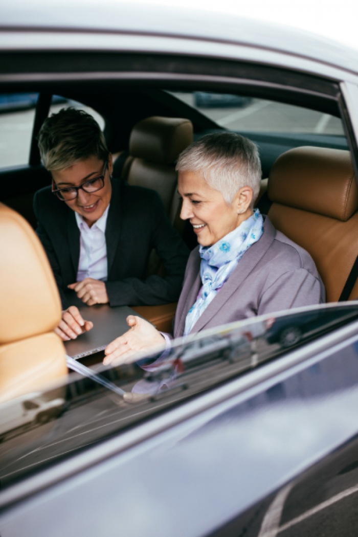 Two women discussing vehicle purchase