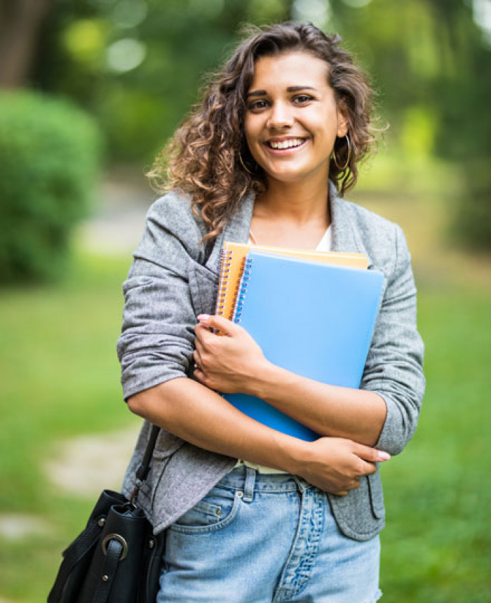 Young college student heading to class.