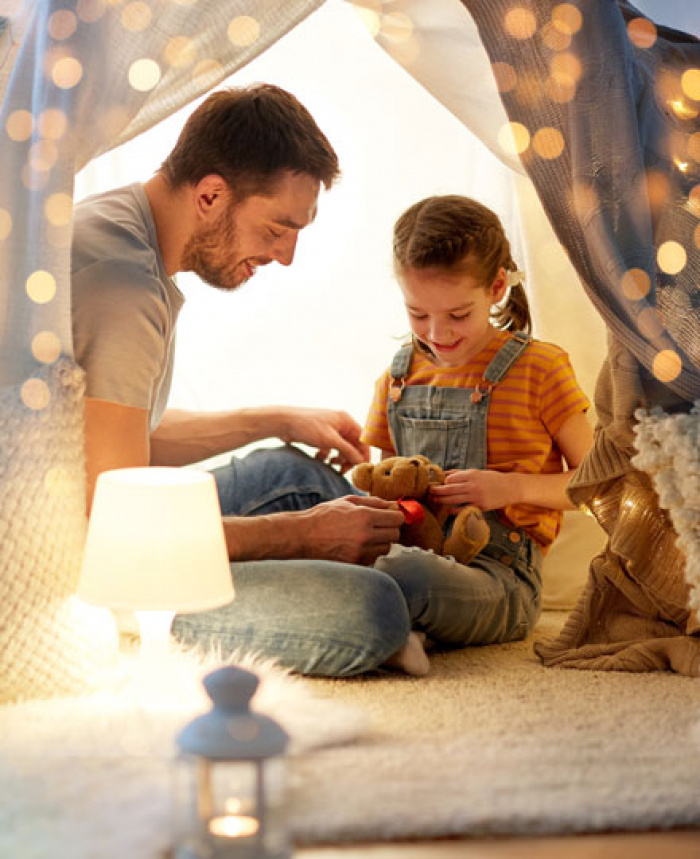 Father and daughter enjoying a night at home.