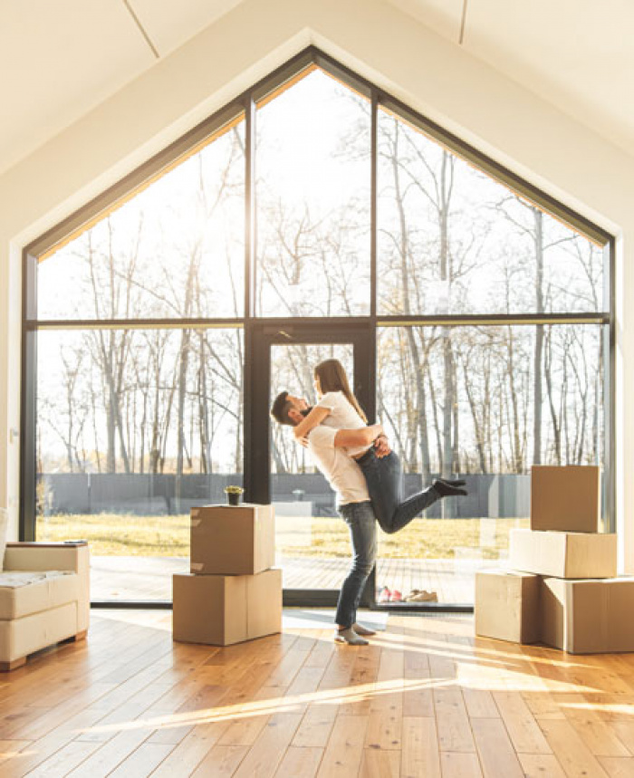 Couple celebrating their new home.