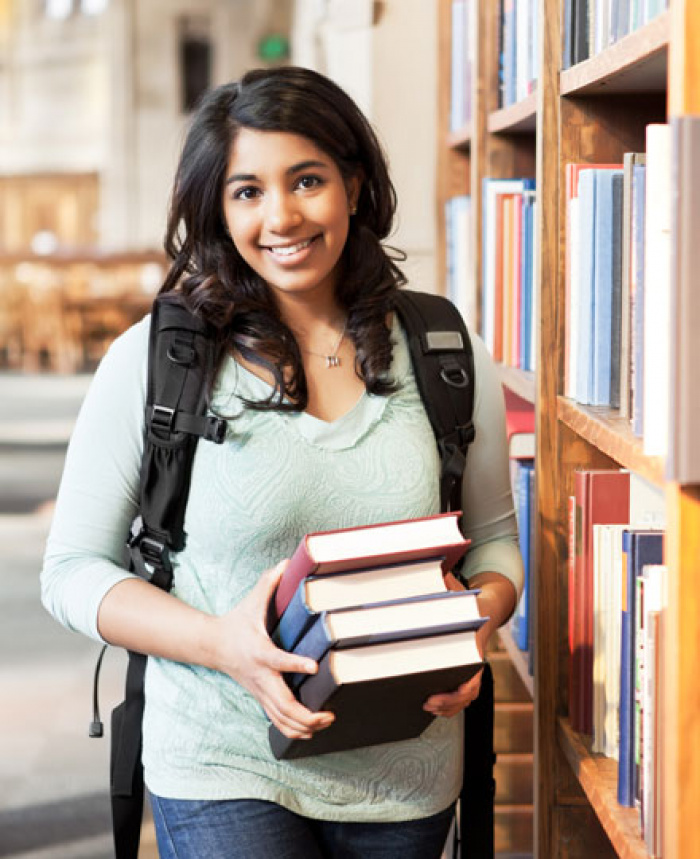 College female student at the library.