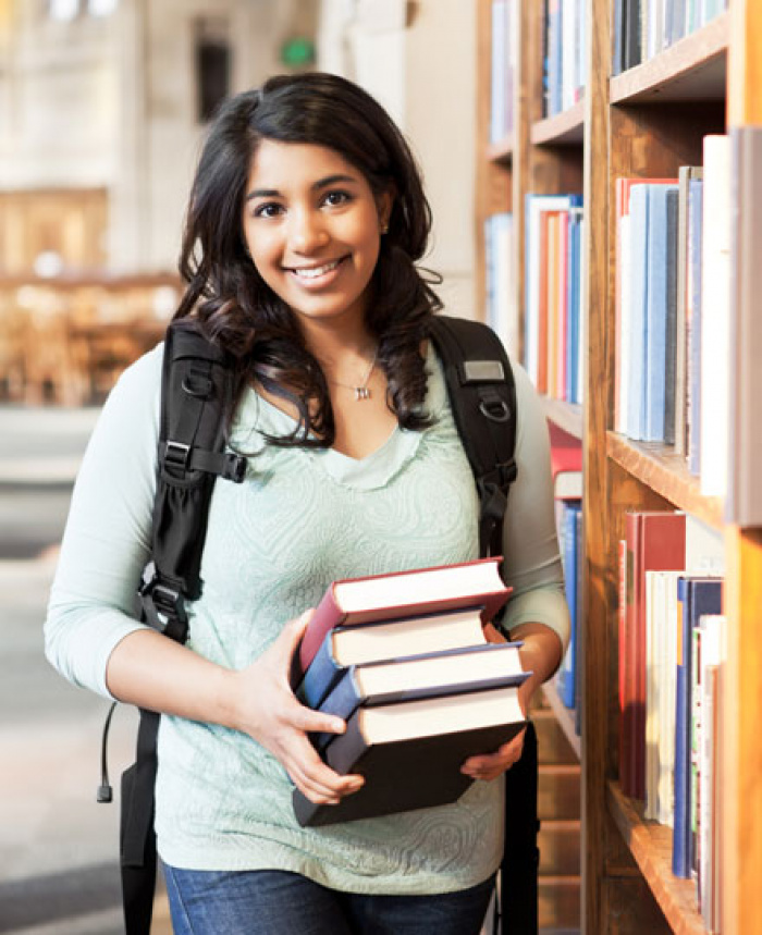 College female student at the library.