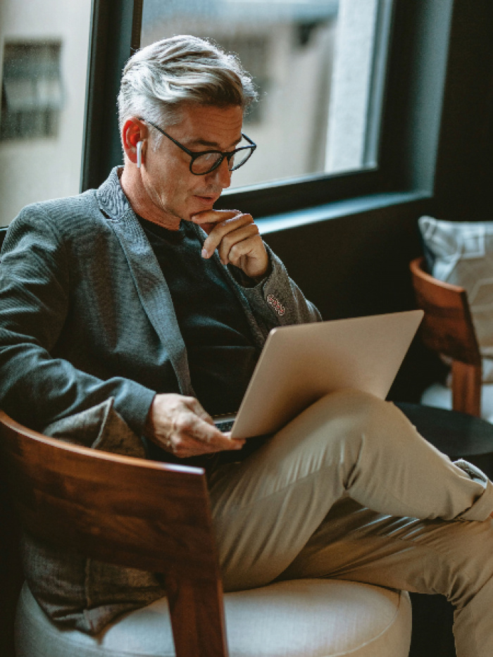 Businessman looking busy working on laptop