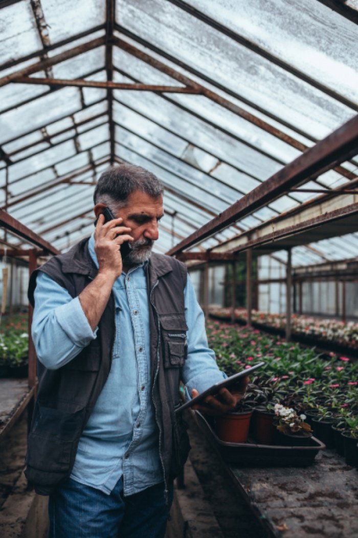 Man on cellphone at work