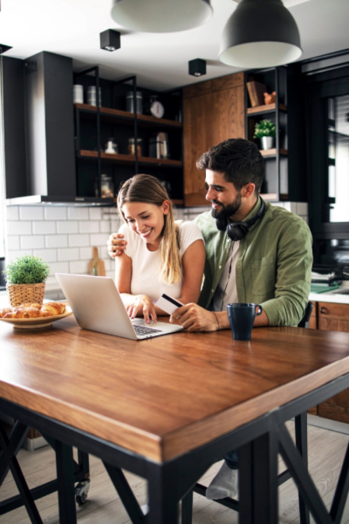 Couple paying for transaction with credit card