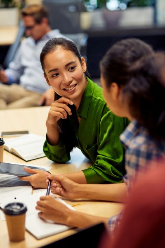 Business woman chatting with coworker