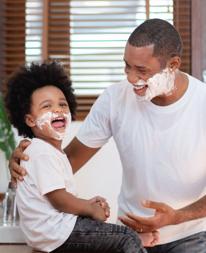 Father teaching his son about saving.