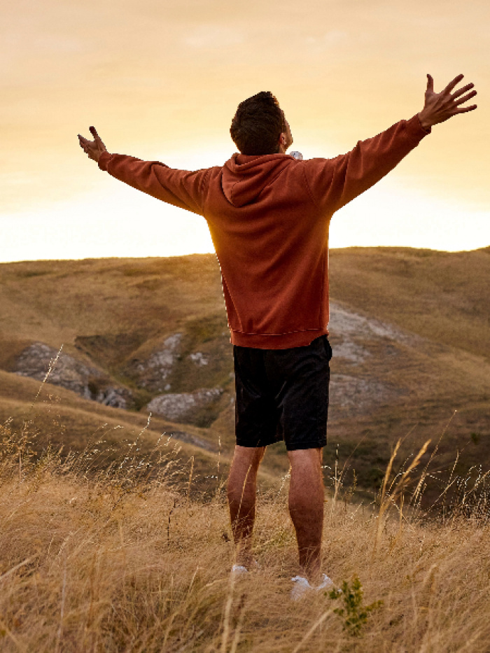 Man with arms raised in celebration