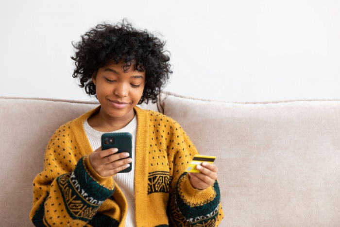 Young woman using digital banking