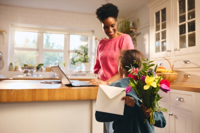 Daughter surprising mother with a gift card