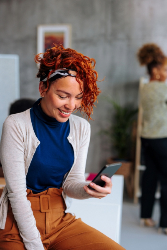 Woman using digital banking on her cellphone