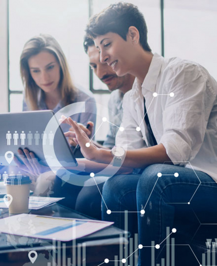 Business team reviewing something on a digital tablet