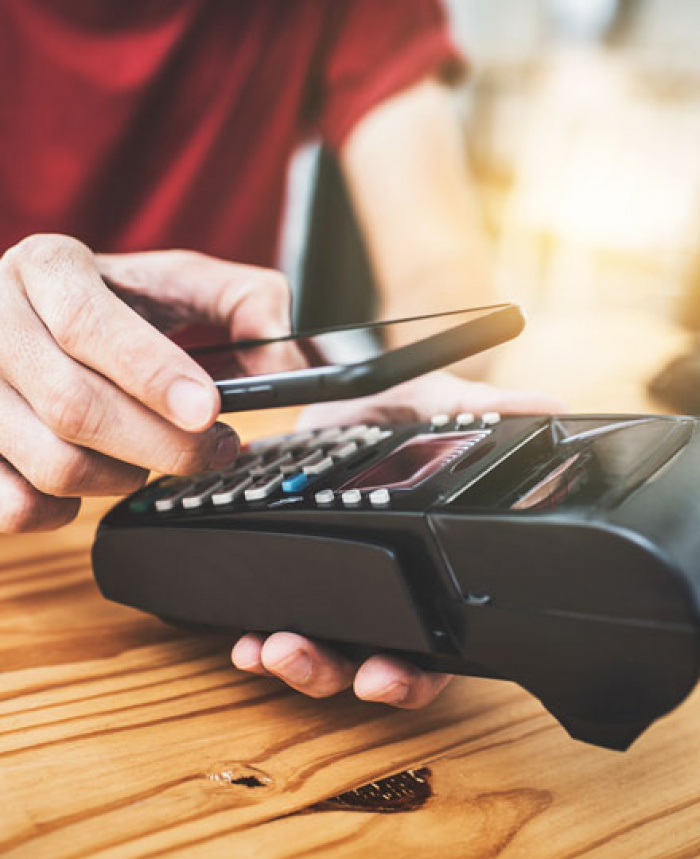 Person paying with mobile phone