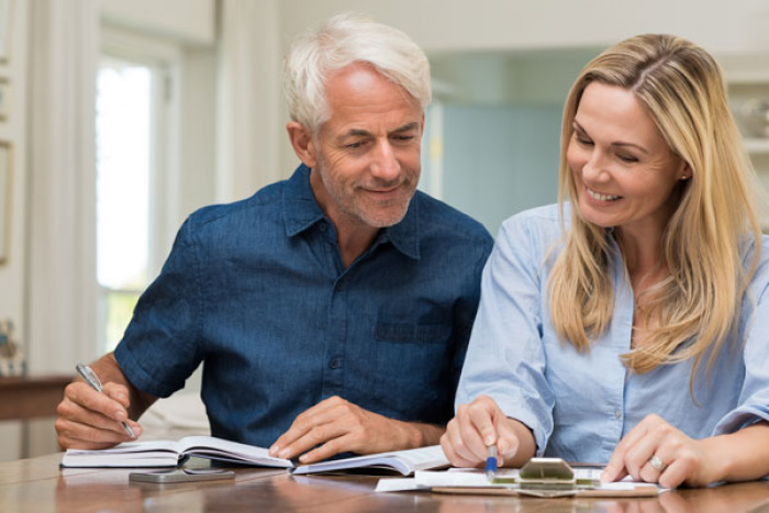 Retiring couple reviewing documents