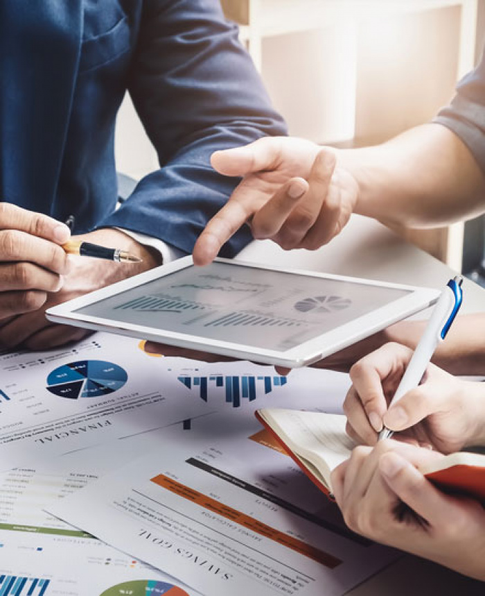 Three people reviewing finance plan