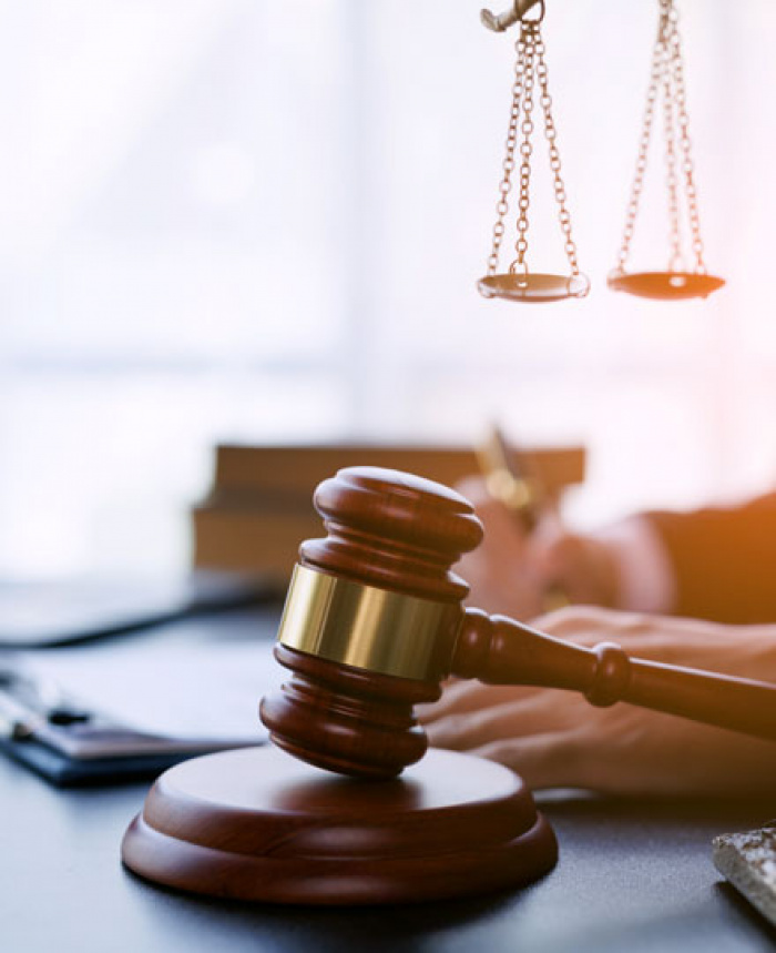 Gavel and justice scales on lawyers desk