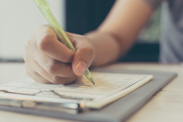 paper forms being filled out