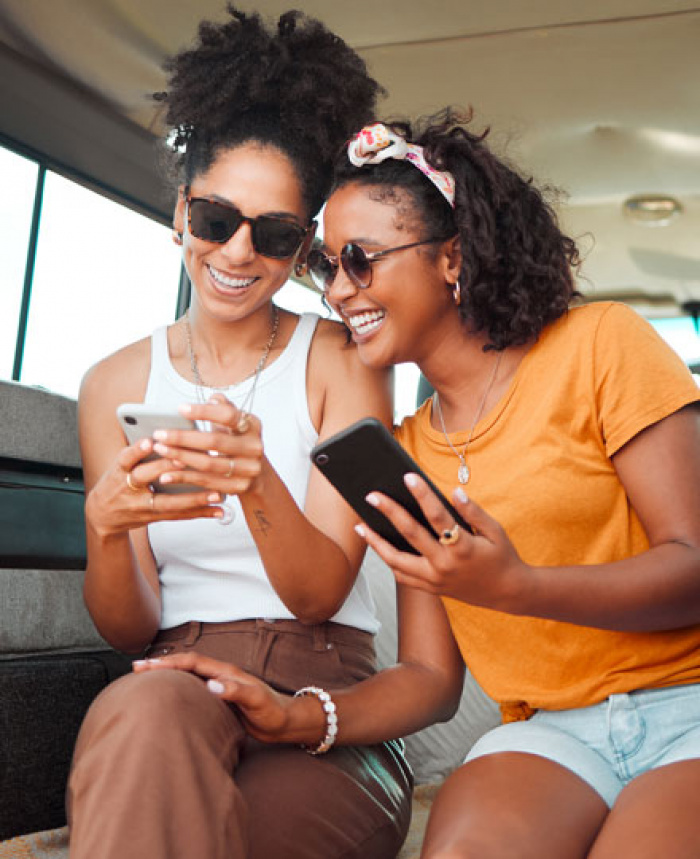 Two women reviewing their digital banking on the app.