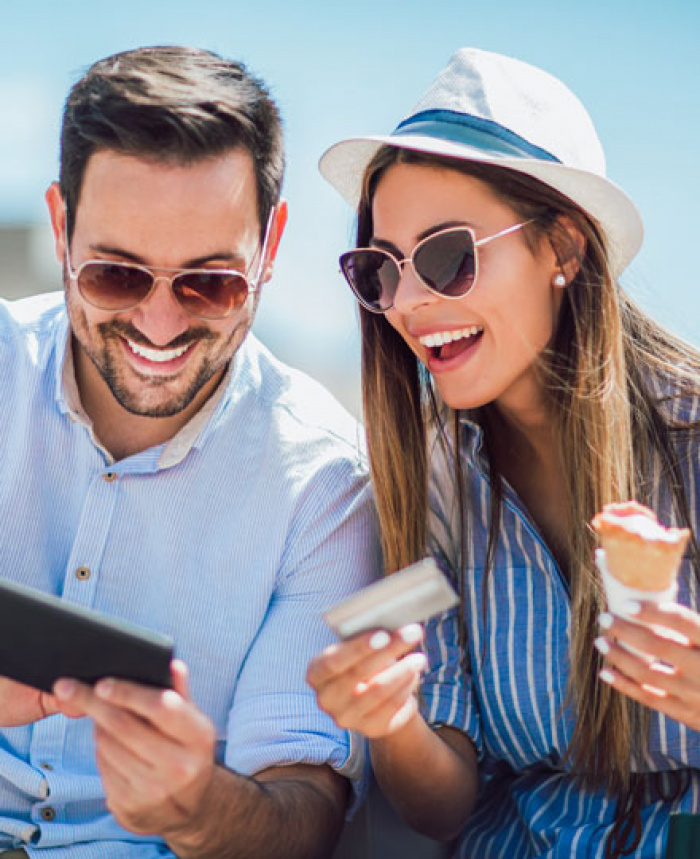 Couple enjoying shopping with their FCFCU credit card.