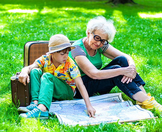 Grandmother and grandson looking at map